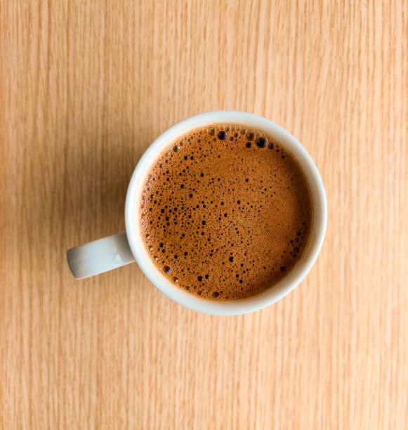 istock cup of coffee on wooden table 1322107975