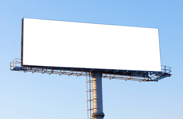 istock Big horizontal blank billboard on the blue sky background, mock up 1322108878