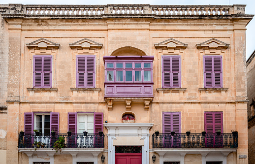 Old medieval building in Villegaignon street facing Saint Paul's Square, in Mdina, Malta. Typical Maltese architecture.