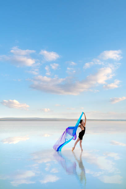 istock Beautiful dancer, dancing on the lake, with tulle 1322113388