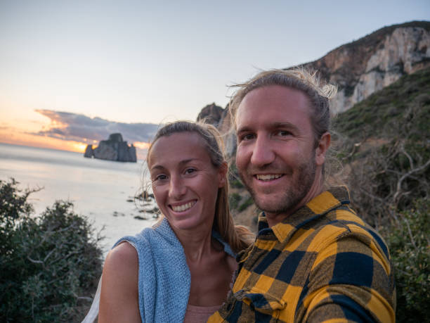 istock Couple take selfie at sunset, Sardinia 1322115571