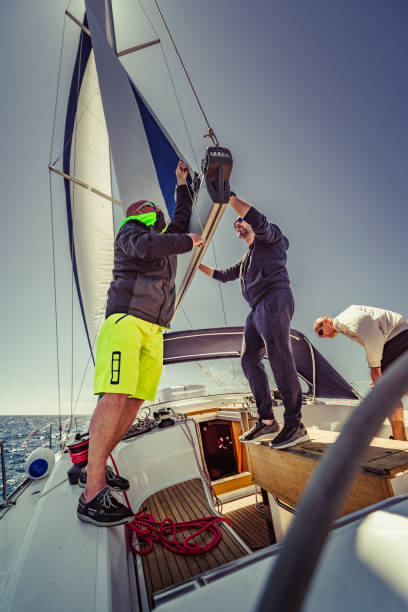 istock Adventure friends on the sailing boat 1322116166