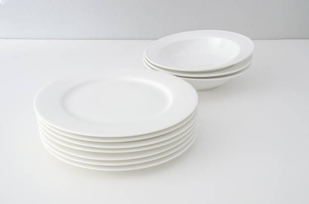 istock A set of clean white dishes on a clean background. Minimalist tableware 1322118770