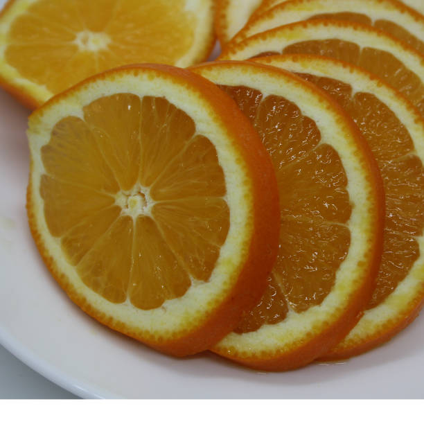 istock Juicy orange slices on a white background. Vitamin C. 1322121498