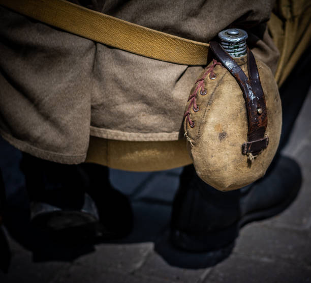 istock A drinking flask on a soldier's belt. 1322128221