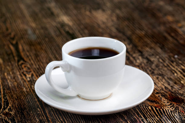 istock coffee beans in a cup, close up 1322130972