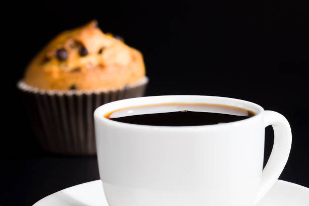 istock a delicious fresh bun and a cup of black aromatic coffee 1322133809