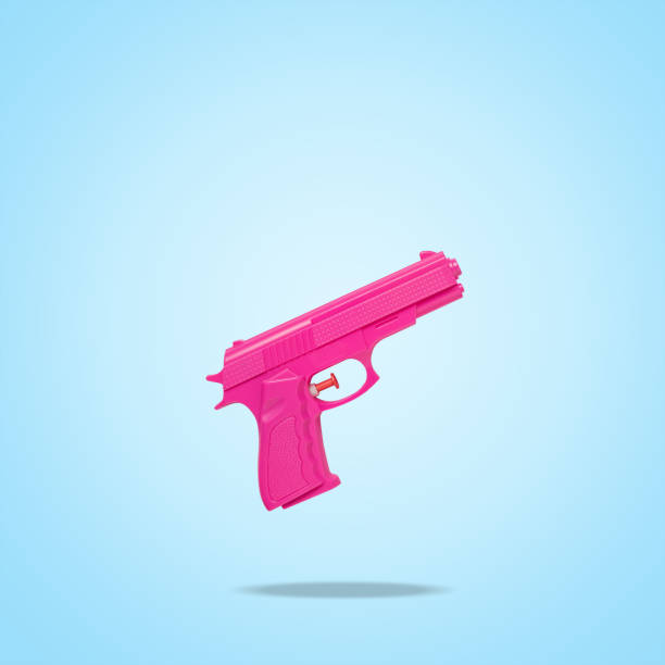 istock Pink handgun on bright blue background. Minimal creative concept. 1322135302