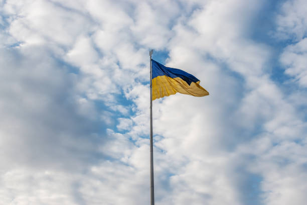 istock Ukrainian flag waving in the wind against the sky. 1322135331