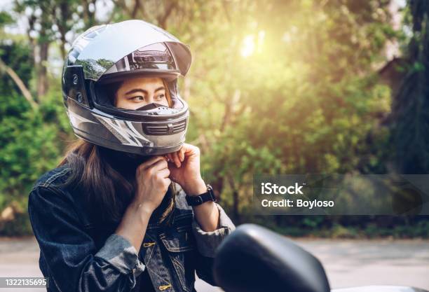 Confidence Asian Woman Wearing A Motorcycle Helmet Before Riding Stock Photo - Download Image Now