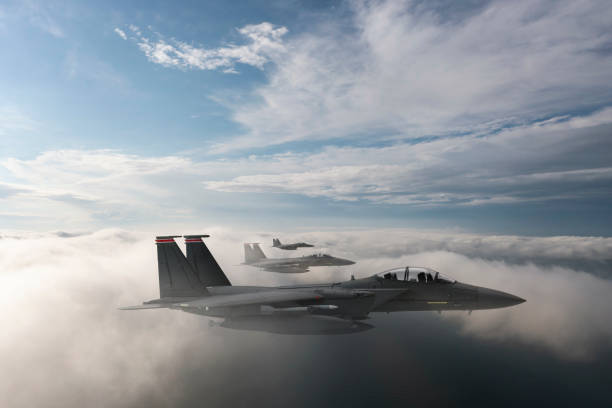 istock Jet fighters flying over the clouds. 1322136408
