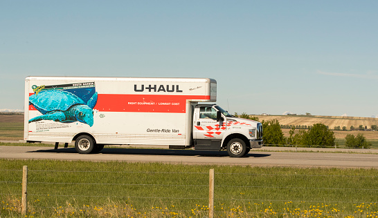 A U Haul truck carrying freight north on the Queen Elizabeth II Highway near Airdrie, Alberta. Taken on May 30, 2021