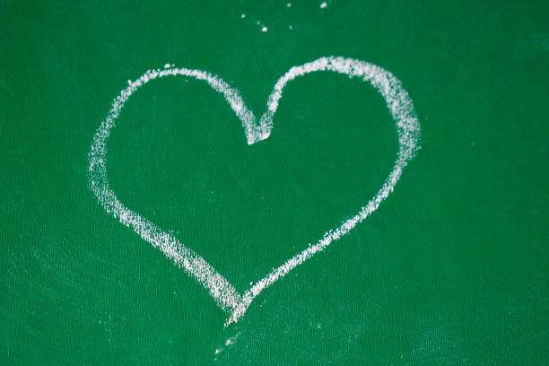 istock Heart on a green writting board 1322138206