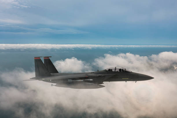istock Jet fighters flying over the clouds. 1322138225