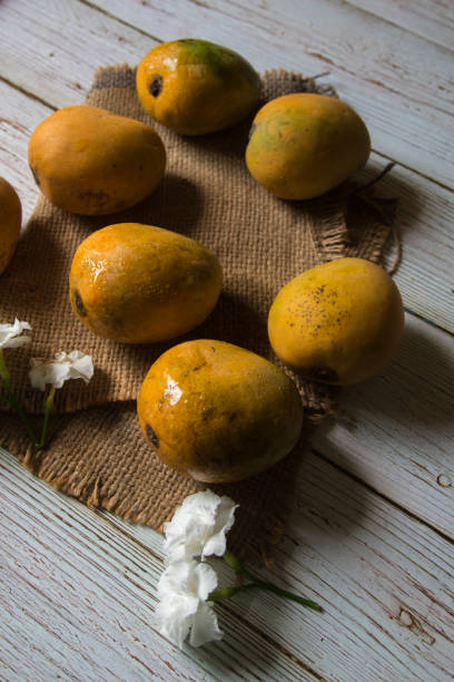 Ripe mangoes with use of selective focus.