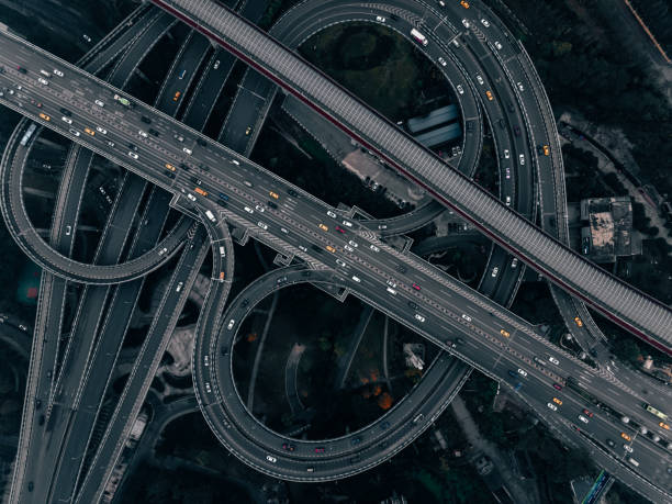 istock Aerial View of Complex Overpass and Busy Traffic 1322139040