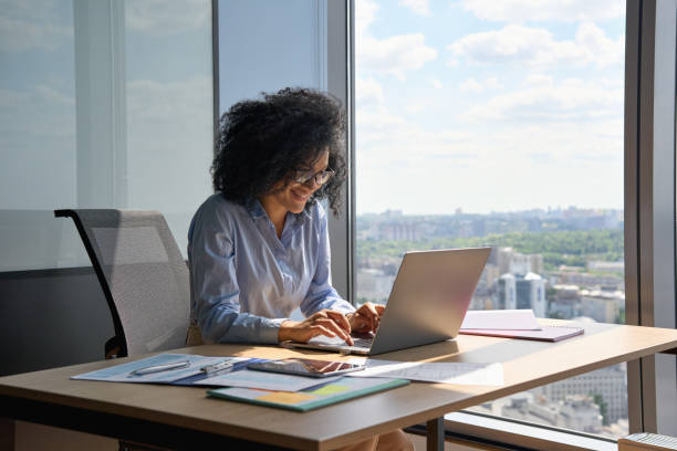 istock Smiling African American financial manager working typing using pc laptop. 1322139139
