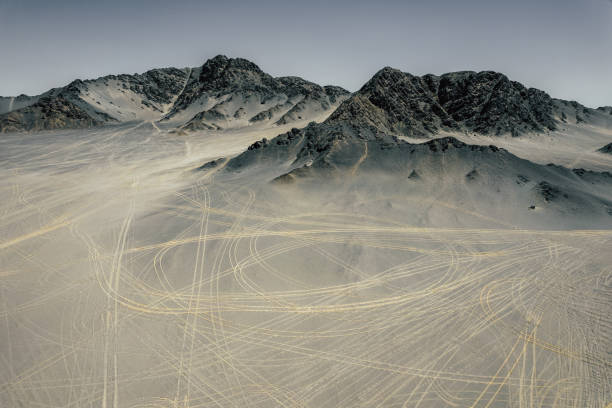 Aerial View of Moutains and Tire Traces / Qinghai, China Aerial View of Moutains and Tire Traces / Qinghai, China extreme terrain stock pictures, royalty-free photos & images