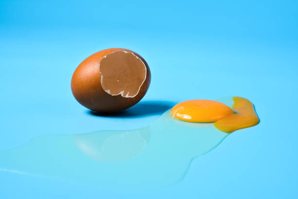 istock Fresh eggs in a sack bag on blue background. 1322143140