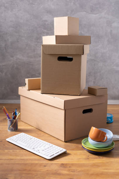 istock Cardboard boxes and things for moving to new home. Stack of cardboard box on floor background.  Move relocation into new house 1322143214