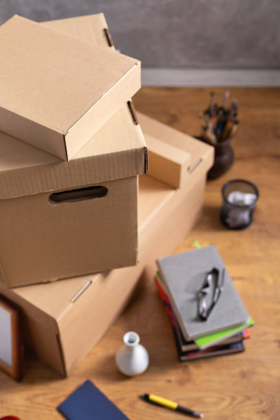 istock Cardboard boxes and things for moving to new home. Stack of cardboard box on floor background.  Move relocation into new house 1322143250