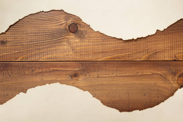 istock old retro aged paper parchment on wooden background 1322144487
