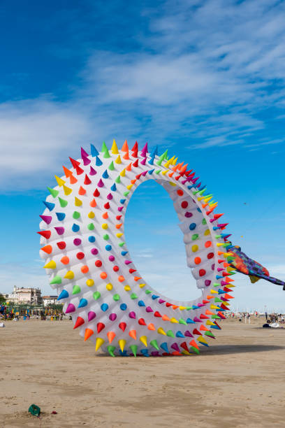 istock Colorful Kites flying over the sky 1322145927