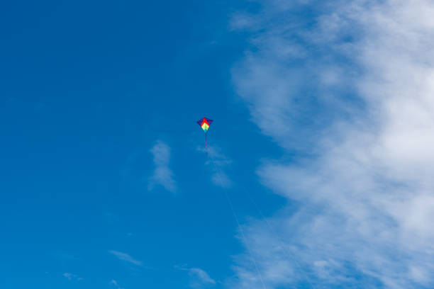 istock Colorful Kites flying over the sky 1322146006