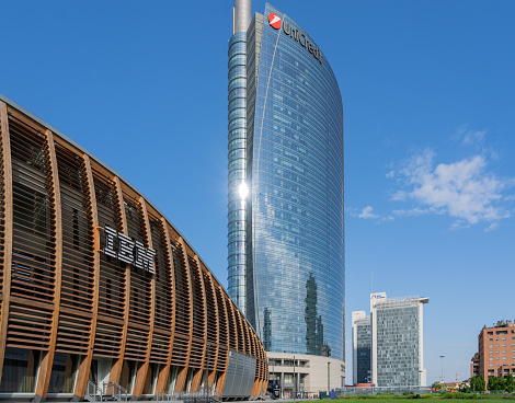 Milano, Italy. The IBM studios, the house of technological innovation in Milano. A building made of glass and wood. In the background the Unicredit tower