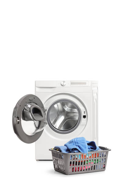 istock Studio shot of an emptied washing machine and a laundry basket 1322149025