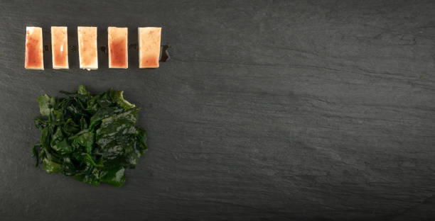 istock Wakame Seaweed on Natural Stone Background, Algae Food 1322150605
