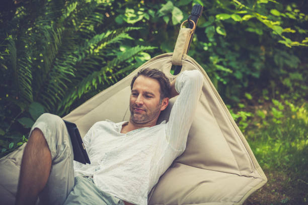 istock reading ebooks in the garden 1322150623
