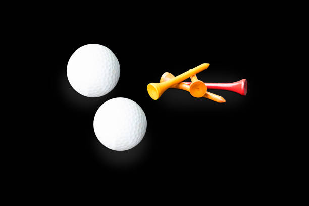 istock Golf ball and red tee pegs on the black background 1322151291