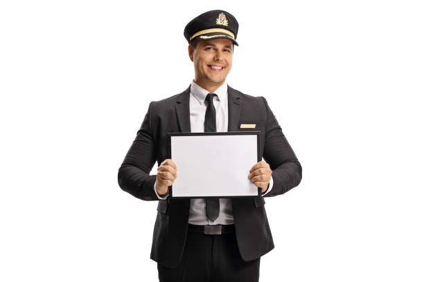 Porter in a uniform holding a blank board Porter in a uniform holding a blank board isolated on white background airport porter stock pictures, royalty-free photos & images