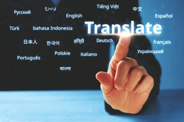 Person abstractly presses on the display with the word translate and foreign languages.