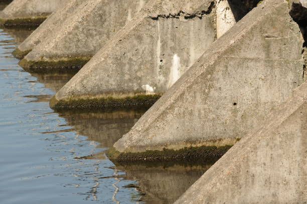 istock stone bridge support in the water. Urban landscape 1322154251