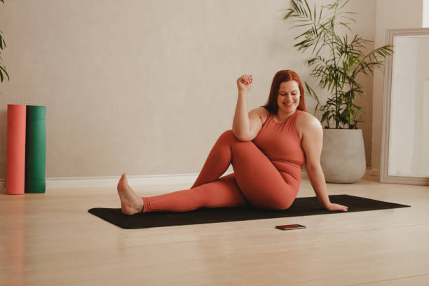 istock Woman doing workout using mobile fitness app 1322154274