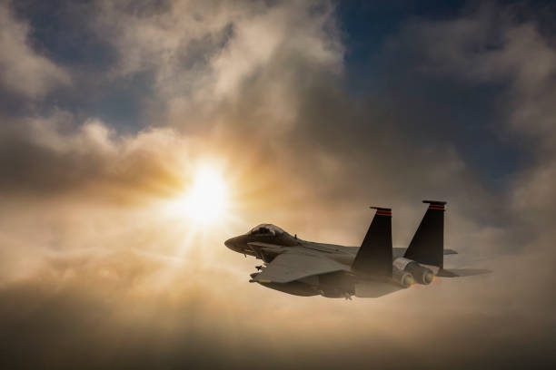 istock Jet fighter flying over the clouds. 1322155020