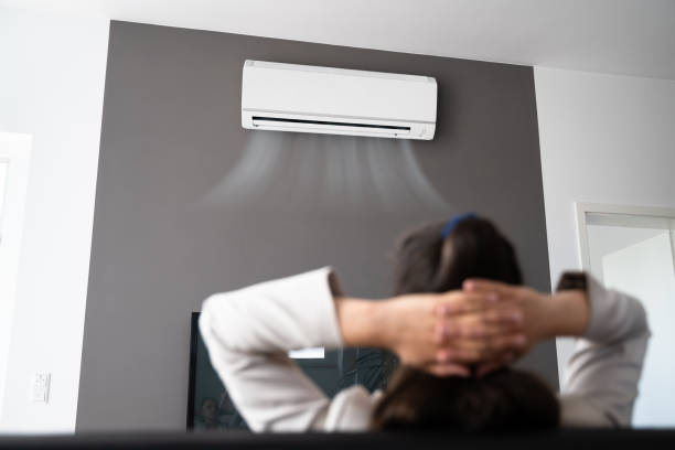 istock Happy Woman Enjoying Air Conditioner 1322155202