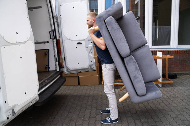 istock Man Lifting Sofa Or Couch Furniture 1322156433
