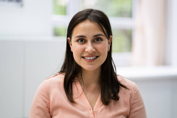 istock Smiling Young Woman Portrait At Workplace 1322156970