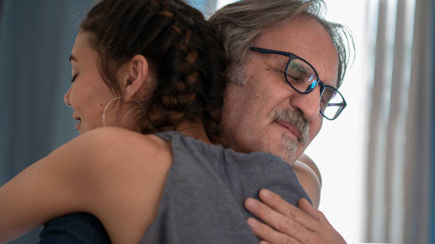 istock Daughter hugs his own father 1322157665