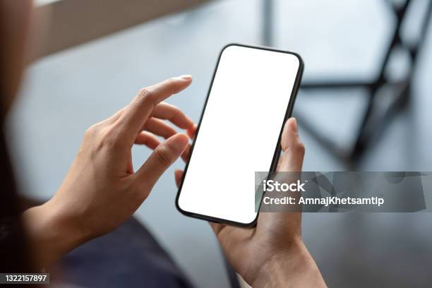 Closeup Of A Businessman Hand Holding A Smartphone White Screen Is Blank The Background Is Blurredmockup Stock Photo - Download Image Now