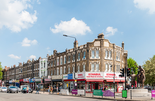 London, United Kingdom. The World Cup Sculpture (The Champions) is a bronze statue of the 1966 World Cup Final  and shops located near West Ham United Football Club's now demolished Boleyn Ground (Upton Park)