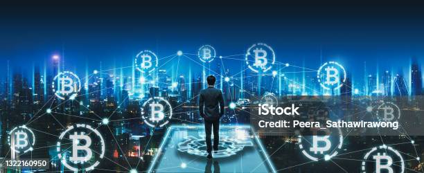 Business Man With Crypto Currency Bitcoin On Network City Technology Background Stock Photo - Download Image Now