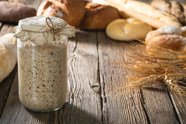 istock Sourdough starter for bread and bakery leavening agent levain on rustic wooden table 1322161281