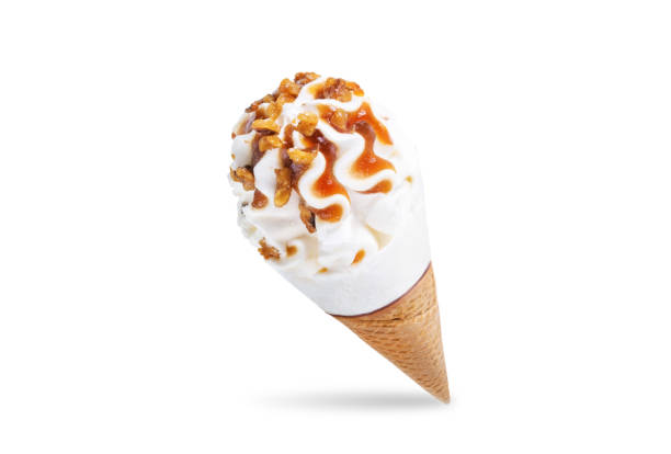 istock Caramel nuts vanilla ice cream in waffle cone on a white isolated background 1322161508