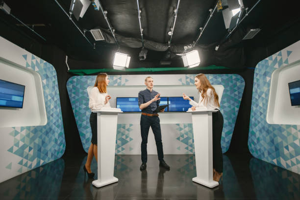 istock Tv host and two participants on game show 1322162037