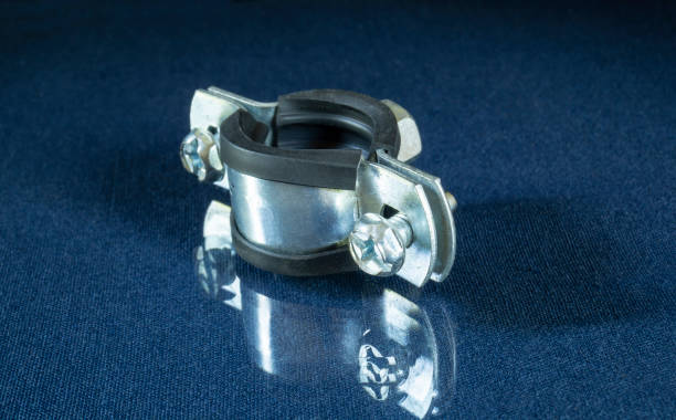 steel water pipe clamp on the table with reflection. - hose clip imagens e fotografias de stock