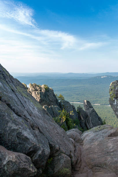 istock view from a cliff in the mountains against a blue sky 1322170974
